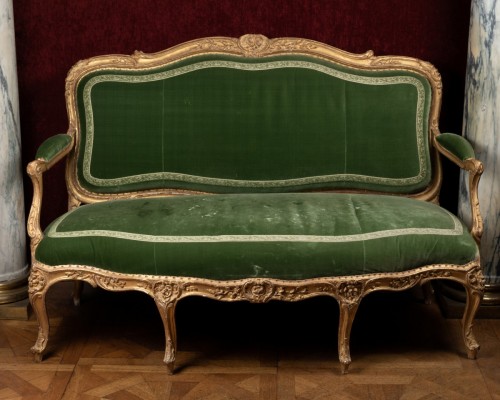 Seating  - A Louis XV gilt-wood salon suite comprising four armchairs and a sofa Stamped by Jean-Baptiste Tilliard
