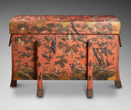 Asian Works of Art  - A large red lacquer chest (karabitsu) decorated with monkeys in relief