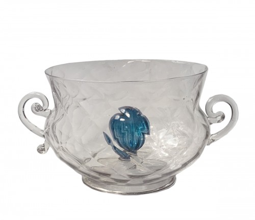 A faceted bowl with handles and a blue gadrooned bulb in the centre