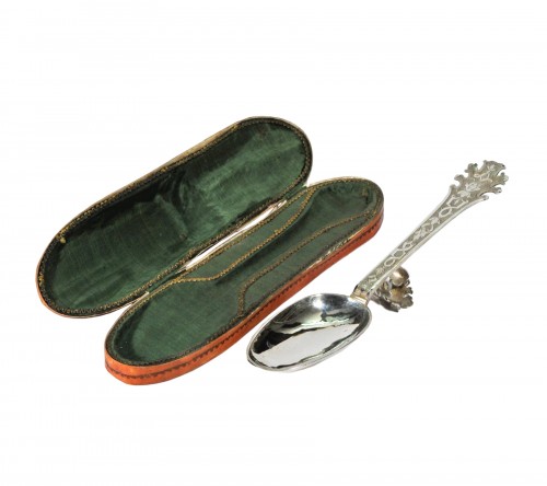 A silver Christening spoon in its leather case