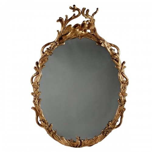 Un miroir ovale en bois doré de Guillaume IV