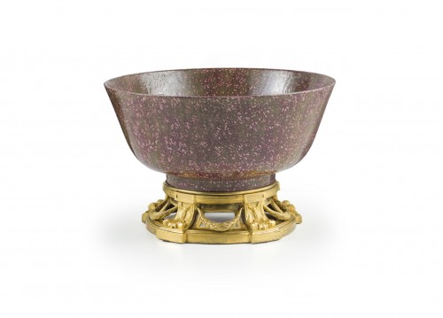 An ormolou mounted faux porphyry porcelain bowl