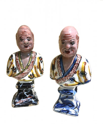 Two Delftware statuettes depicting Asian characters